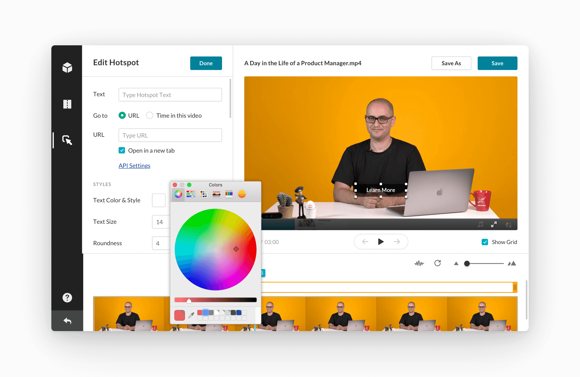 Video editing interface displaying a customization panel for adding an interactive hotspot to a video titled ‘A Day in the Life of a Product Manager.’ The panel allows users to input text, set URLs, adjust text size, and select colors using a color wheel. The preview section shows a presenter with a laptop on an orange background, along with an editable hotspot labeled ‘Learn More.’