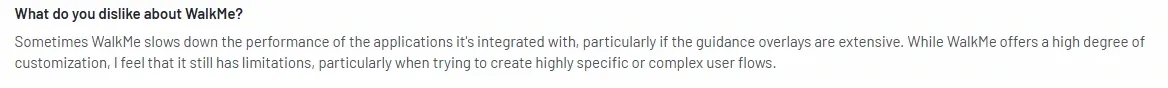 G2 review stating WalkMe slows down applications with extensive overlays and has limitations in complex user flow customization.