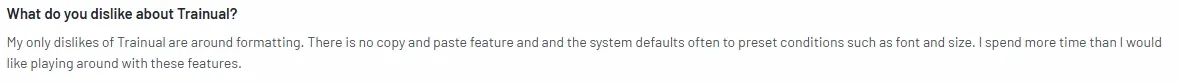 G2 review discussing formatting limitations in Trainual, such as the lack of a copy-paste feature and automatic font and size presets.